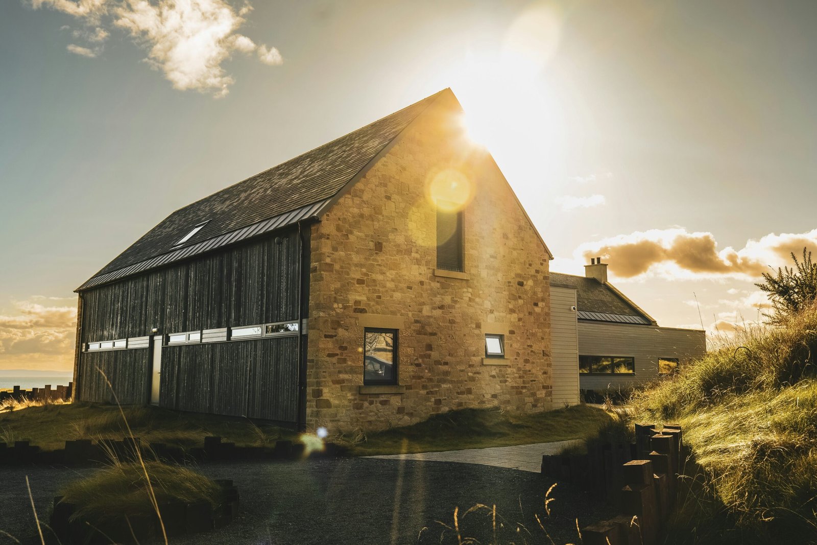 the sun shines brightly on a brick building